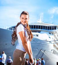 Cruise Ship Worker Poses by Ship