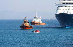 Cruise Ship Towed into Port Photo